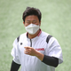 A LG Twins team player practices with a mask on ahead of a preseason game between LG Twins.